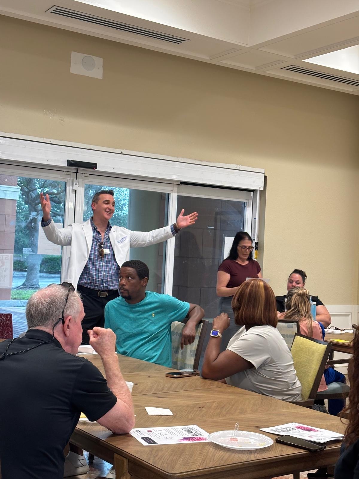 Lively group discussion at Jensen Beach assisted living facility